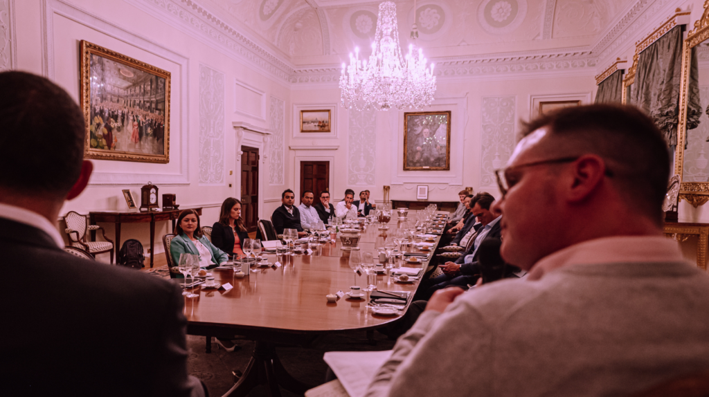 Guests sit around large table